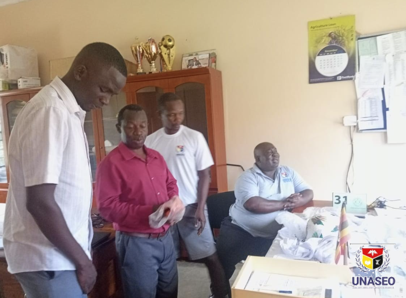Kit handover in the Kalongo Seed staff office